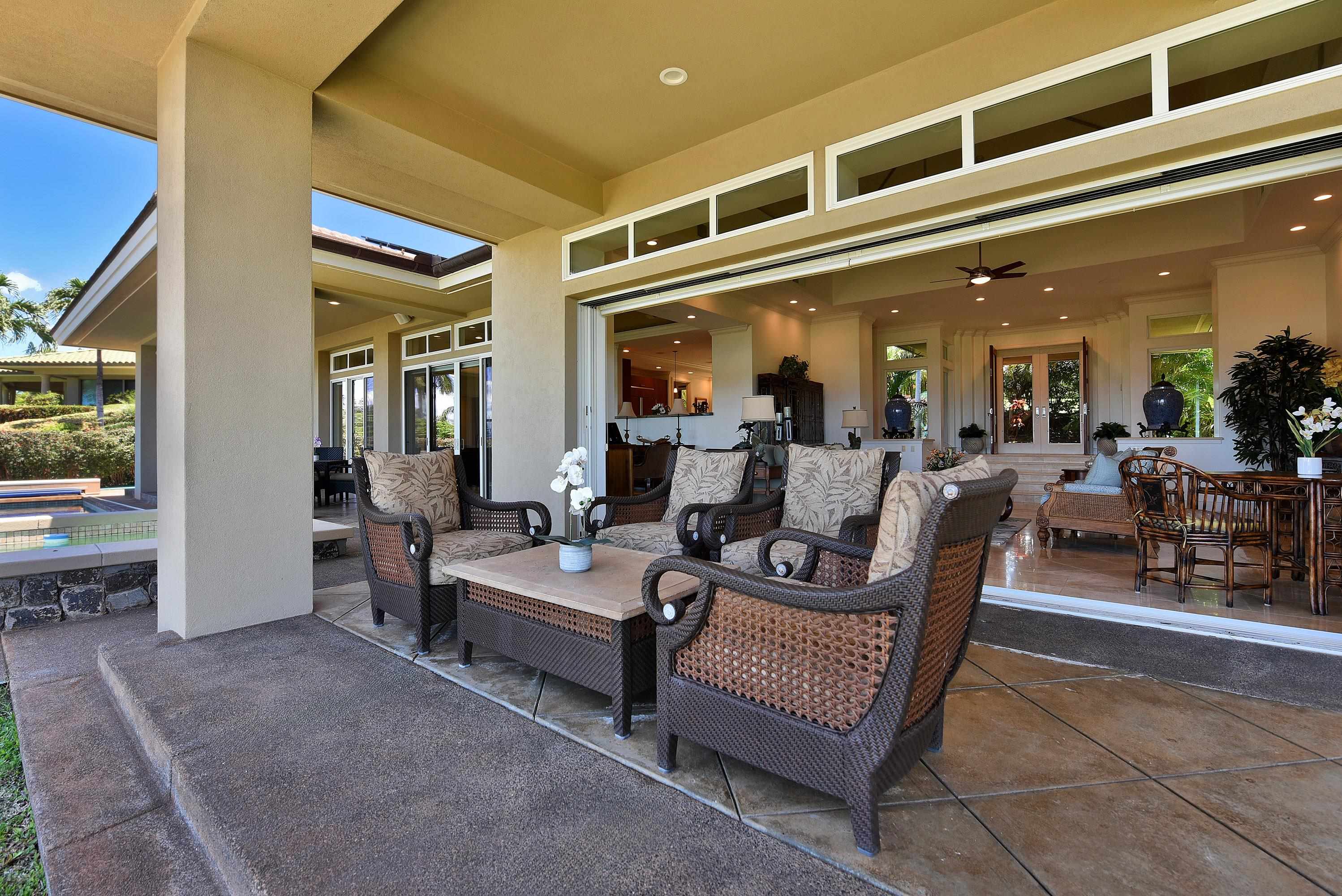 175 Ulukoa Place Lahaina, HI 96761 - Photo 40 of 50 a living room with furniture and a potted plant