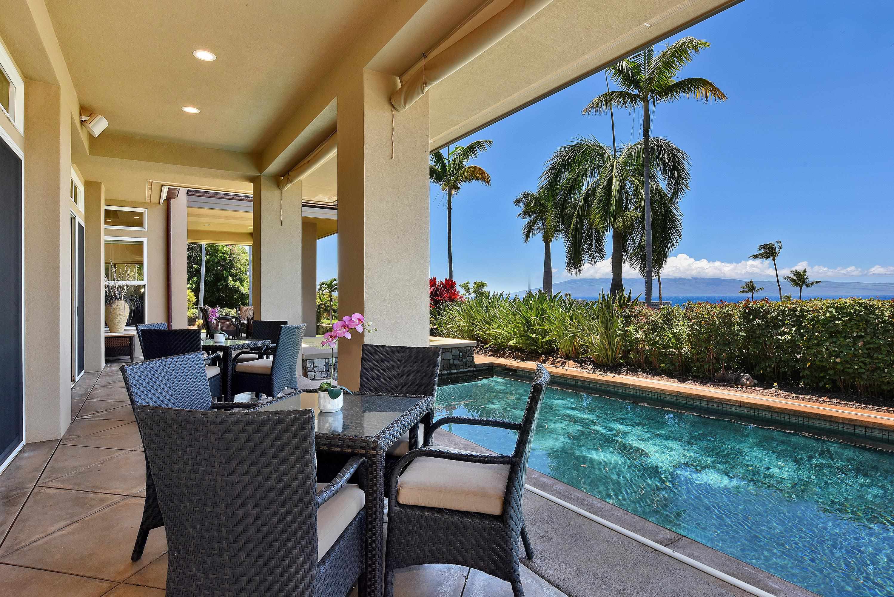 175 Ulukoa Place Lahaina, HI 96761 - Photo 43 of 50 a dining room with furniture and a garden