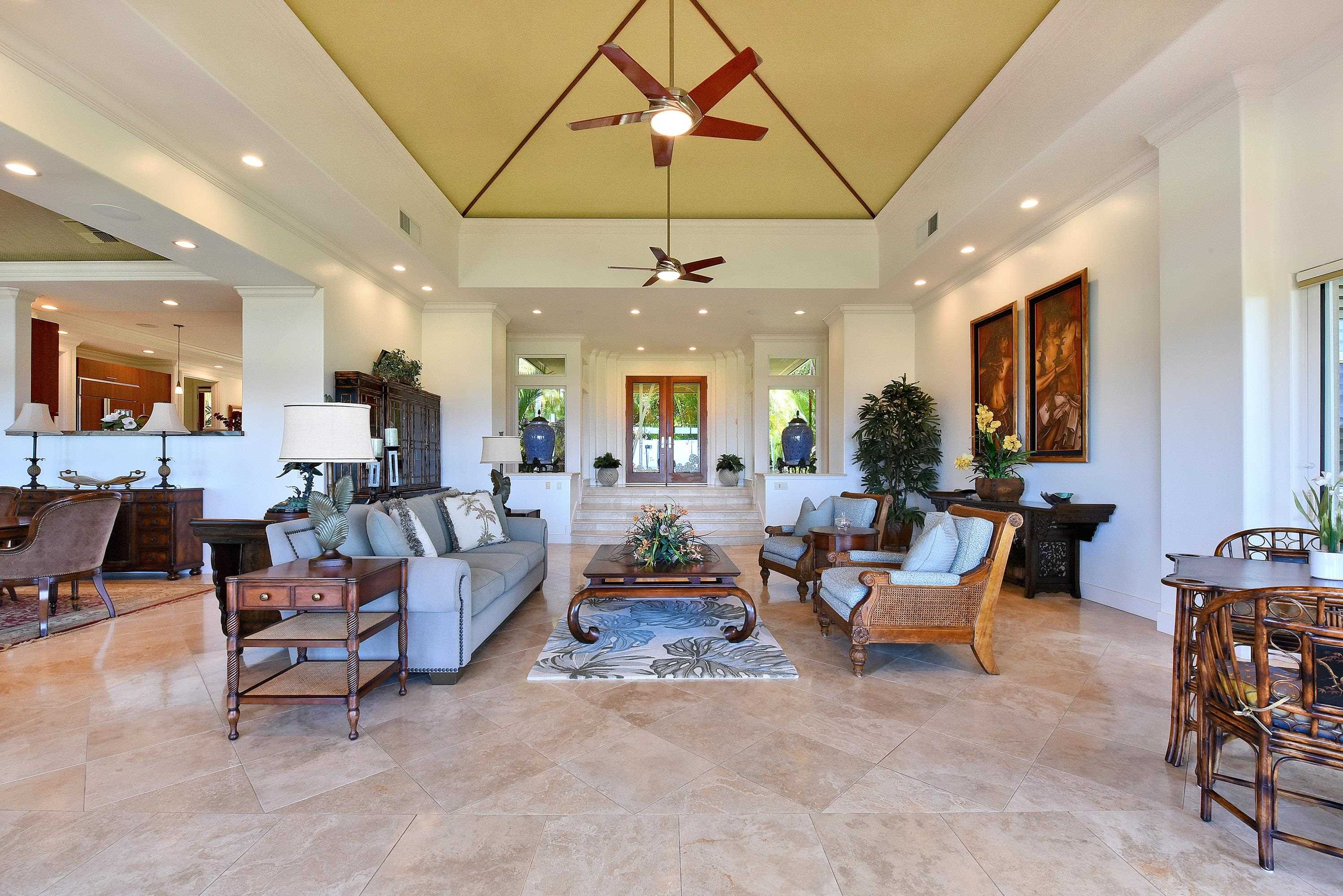 175 Ulukoa Place Lahaina, HI 96761 - Photo 8 of 50 a living room with furniture and a chandelier