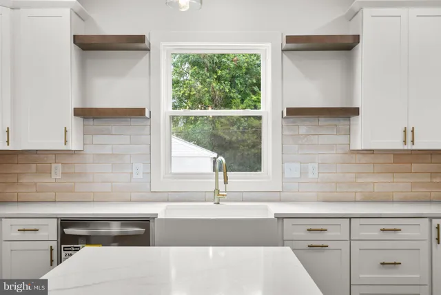a kitchen with a sink and a window