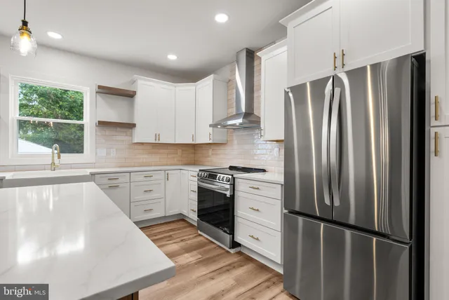 a view of a livingroom with window wooden floor and a chandelier