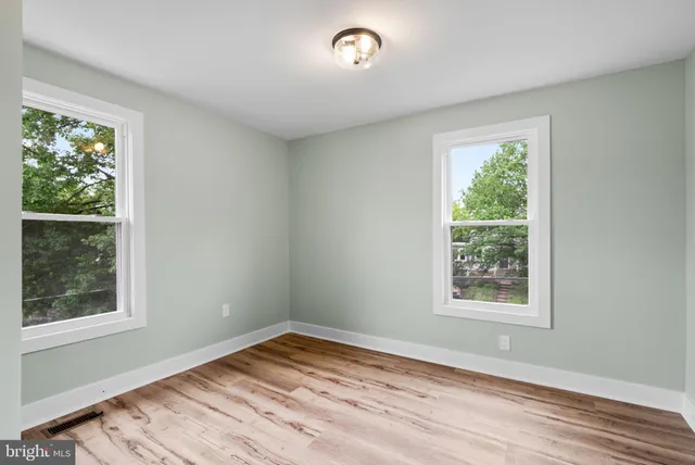 a bathroom with a granite countertop toilet a sink and bathtub