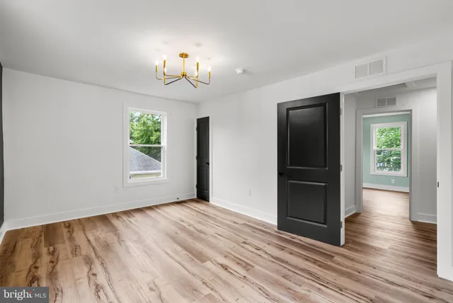a bathroom with a double vanity sink and mirror