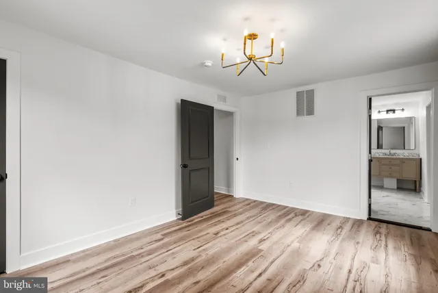 a bathroom with a shower and a glass door