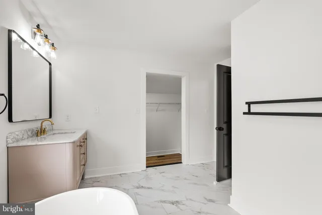 a view of backyard with potted plants and large tree