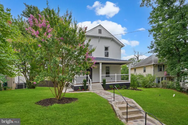 a view of an empty room with wooden ceiling