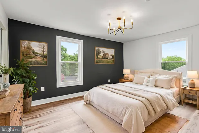 a bedroom with bed and a window