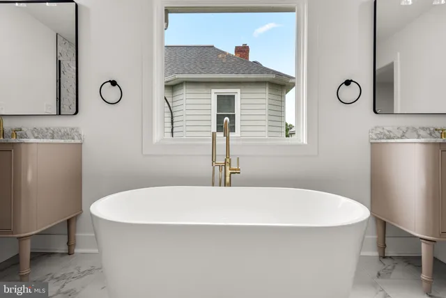 a bathroom with a tub and a sink