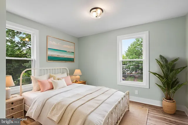 a bedroom with a large bed and a window