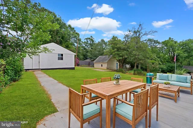 a view of yard with patio