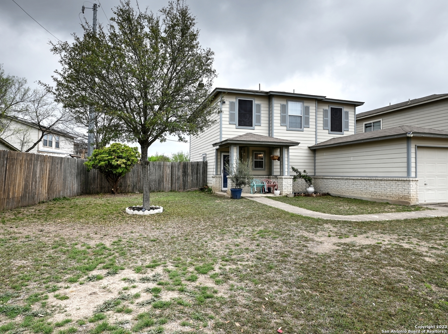 9963 Sungate Park San Antonio, TX 78245 - Photo 1 of 29 a view of a house with a yard