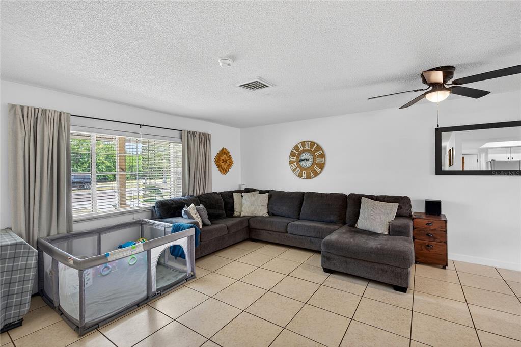 532 Center Road Venice, FL 34285 - Photo 18 of 68 a living room with furniture and a window