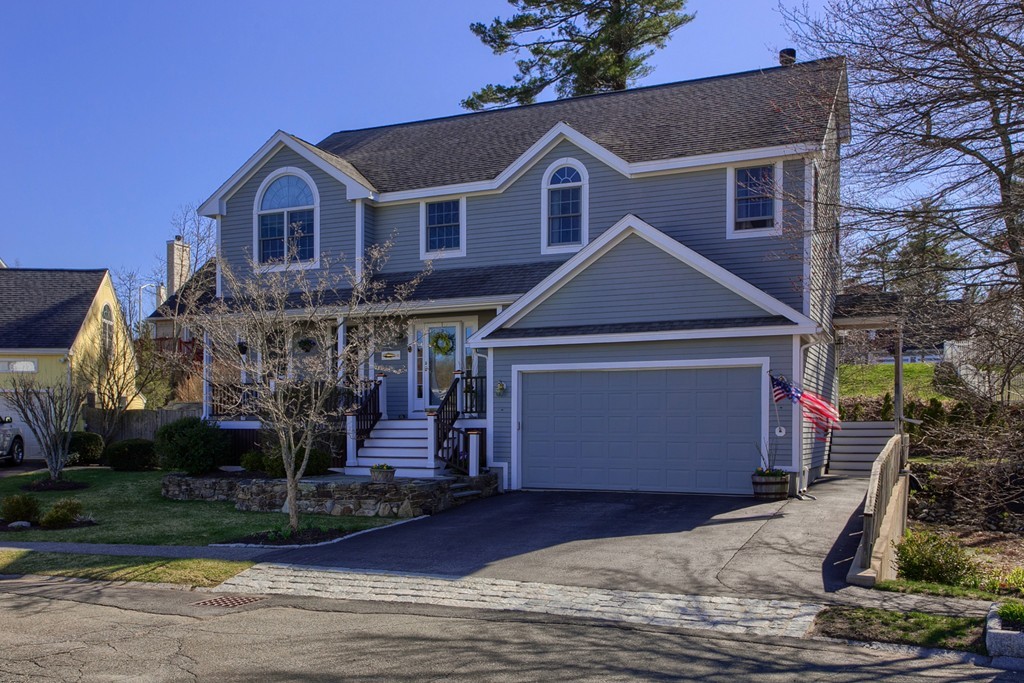 12 Meadow Road Beverly, MA 01915 - Photo 1 of 30 a front view of a house with a yard