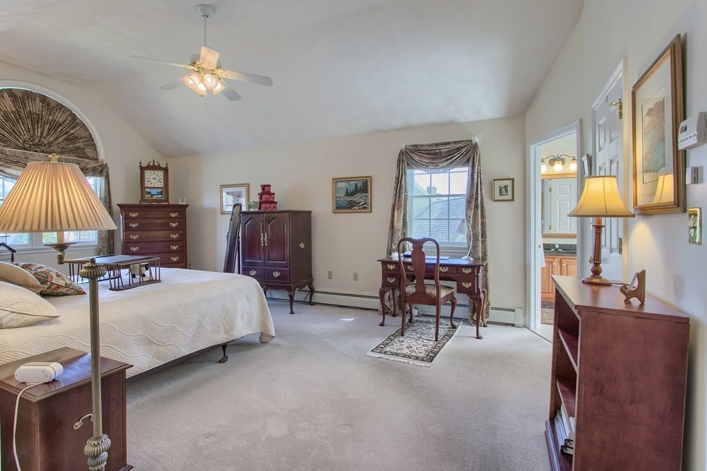 12 Meadow Road Beverly, MA 01915 - Photo 13 of 30 a bedroom with a bed and a chandelier