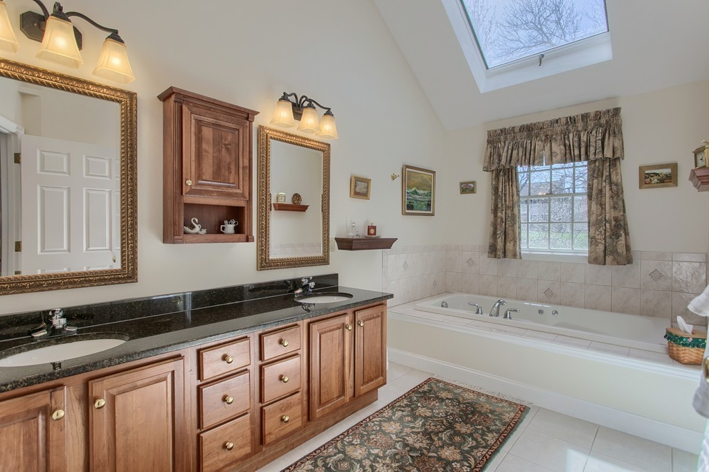 12 Meadow Road Beverly, MA 01915 - Photo 14 of 30 a spacious bathroom with sinks mirror and a bathtub