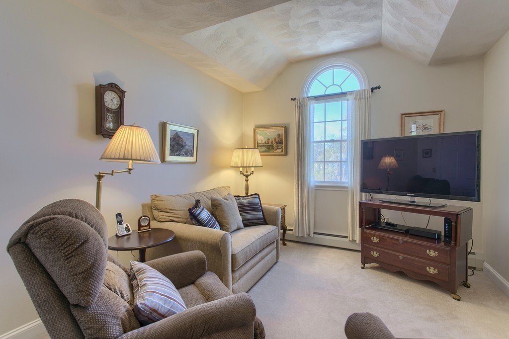 12 Meadow Road Beverly, MA 01915 - Photo 16 of 30 a living room with furniture a ceiling fan and a window