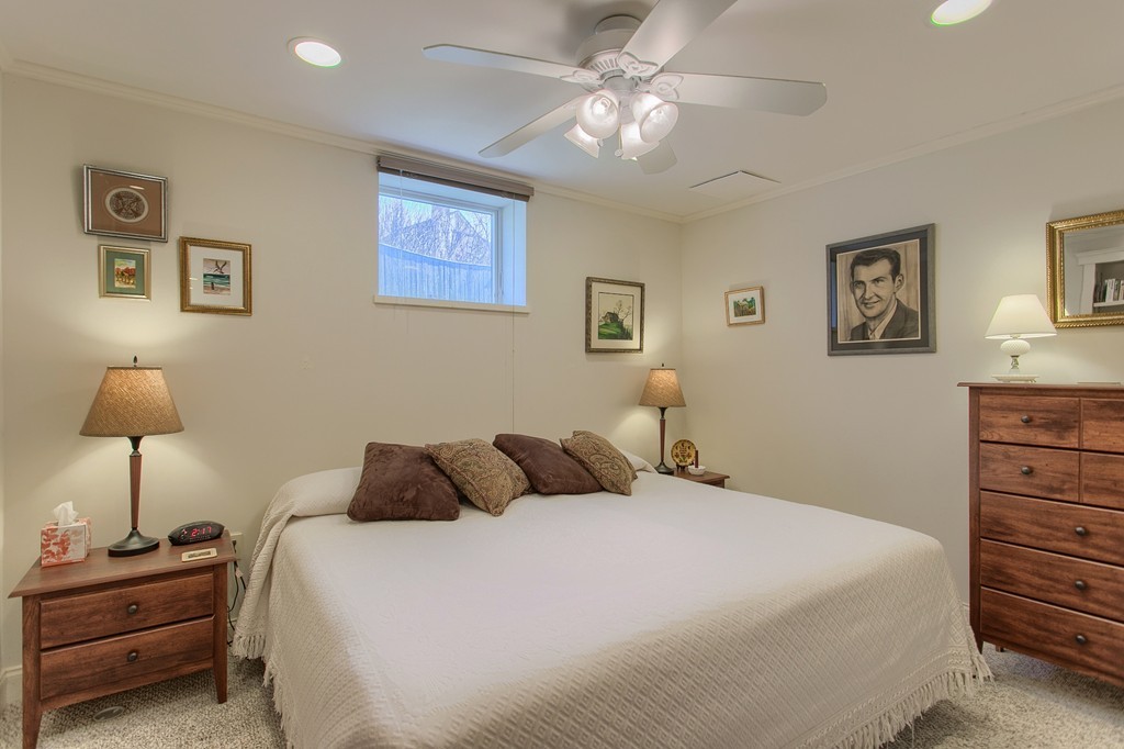 12 Meadow Road Beverly, MA 01915 - Photo 20 of 30 a bedroom with a bed and a lamp on dresser