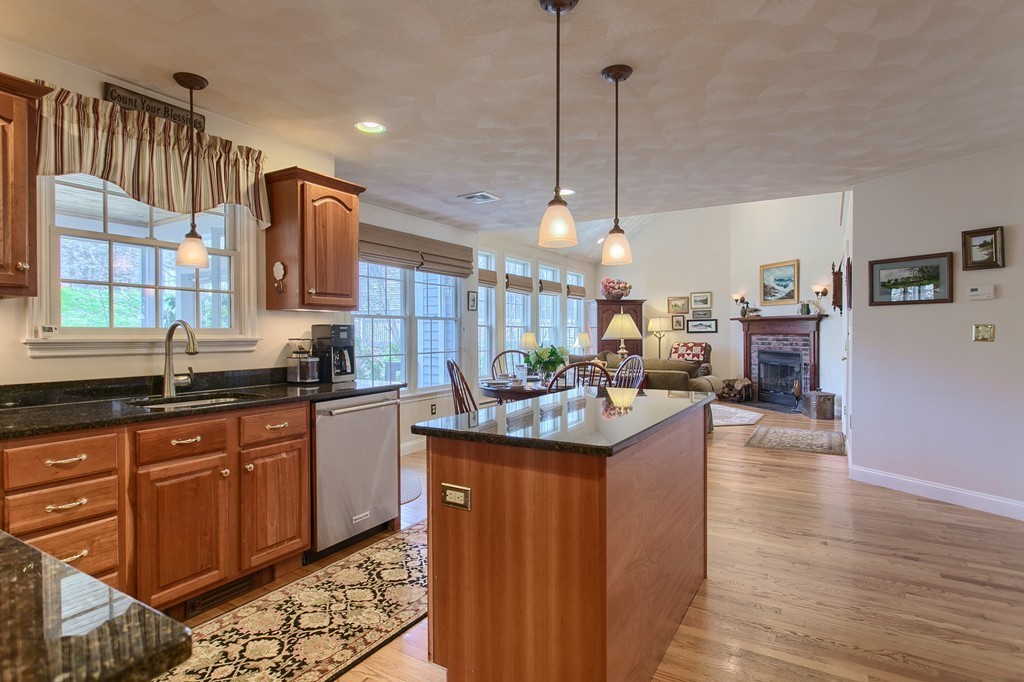 12 Meadow Road Beverly, MA 01915 - Photo 6 of 30 a kitchen with stainless steel appliances granite countertop a sink a stove and a wooden floors