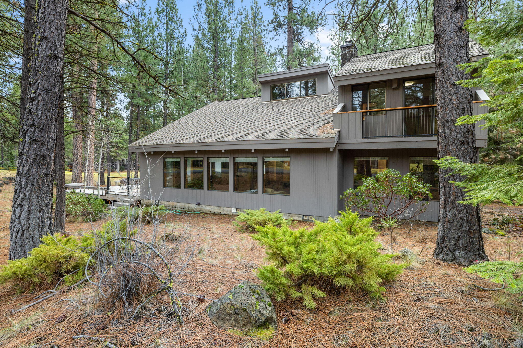 13168 Hawks Beard Black Butte Ranch, OR 97759 - Photo 36 of 47 a front view of a house with a garden
