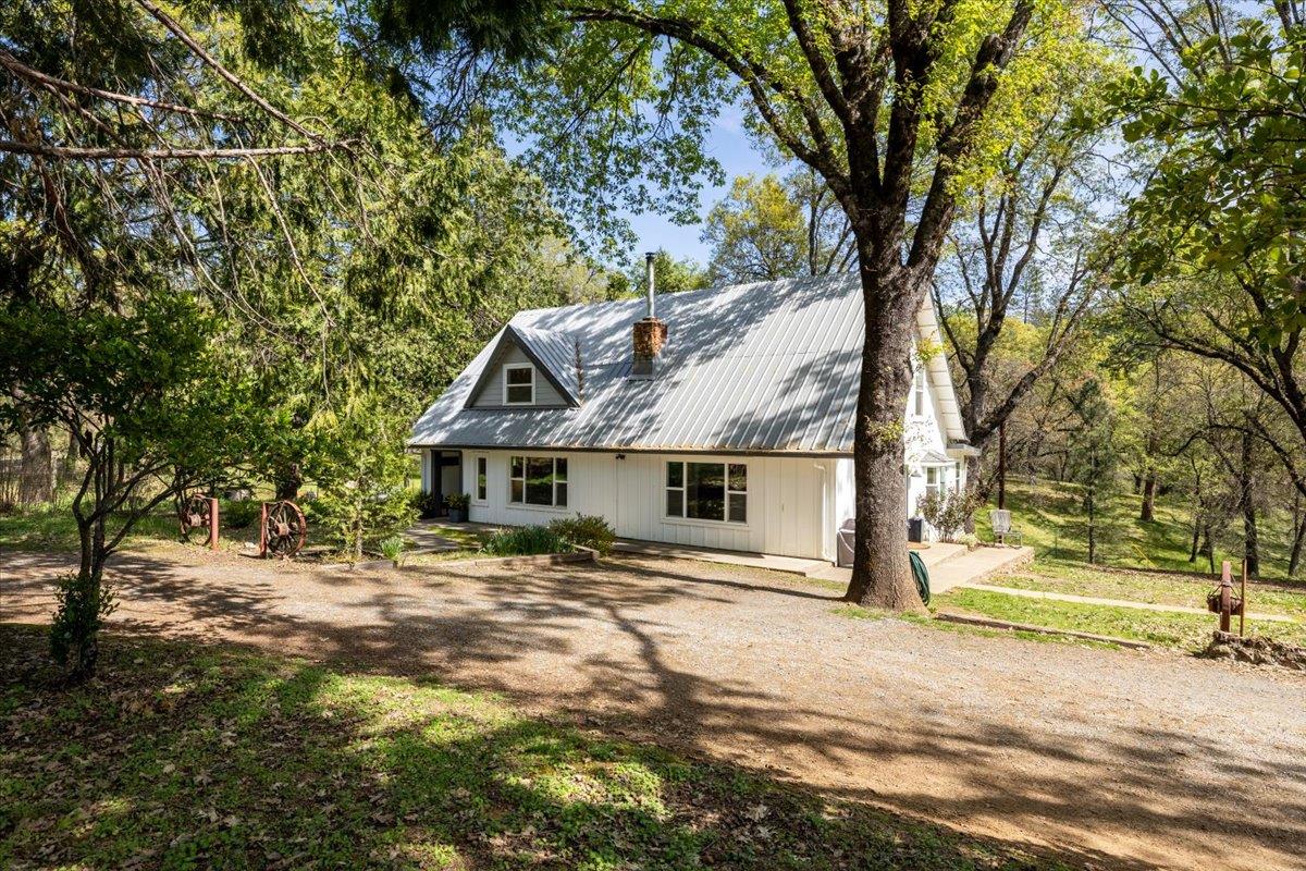 4963 Del Haven Road Placerville, CA 95667 - Photo 2 of 53 a view of a house with a tree in front