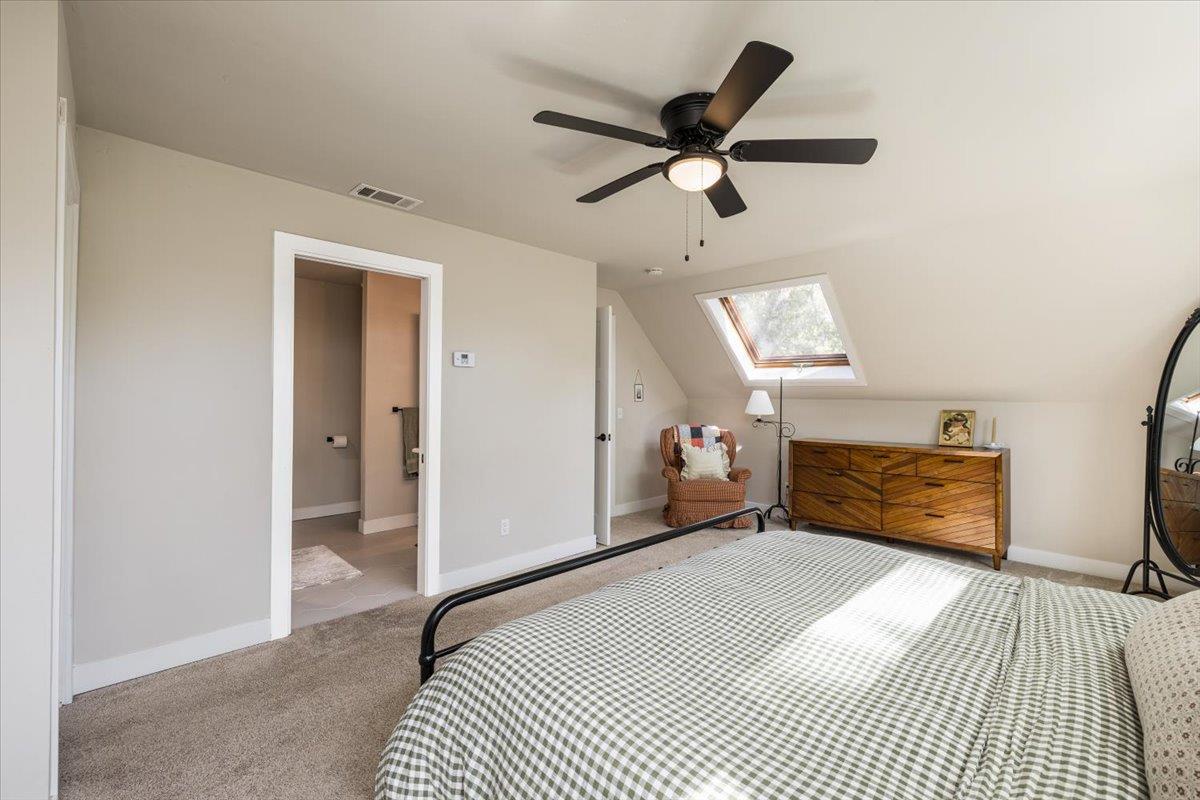 4963 Del Haven Road Placerville, CA 95667 - Photo 28 of 53 a bedroom with a bed and a chandelier
