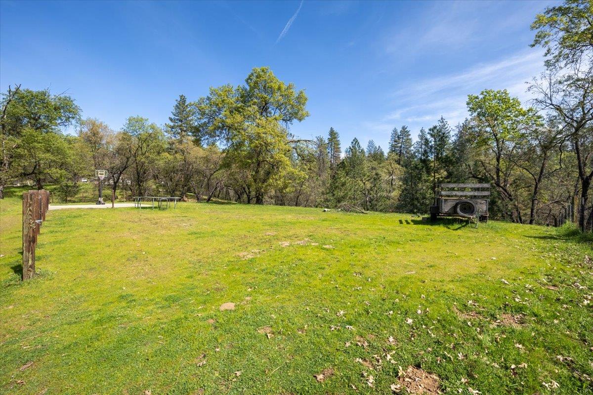 4963 Del Haven Road Placerville, CA 95667 - Photo 45 of 53 a view of a swimming pool with an outdoor space and seating area