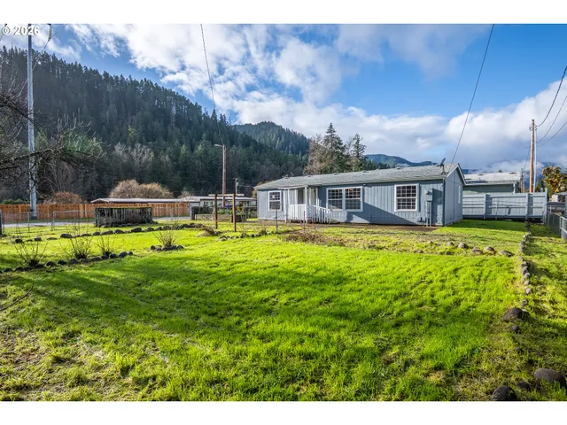 a view of a house with a big yard