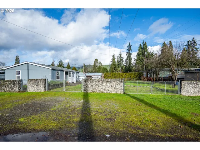a view of a big yard with a house