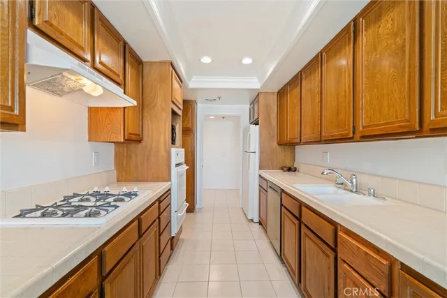 a kitchen with a stove and a refrigerator