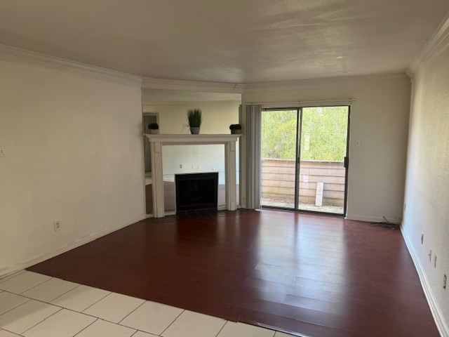 8323 Wilcrest Drive, Unit 8004 Houston, TX 77072 - Photo 1 of 12 a view of empty room with wooden floor and fireplace