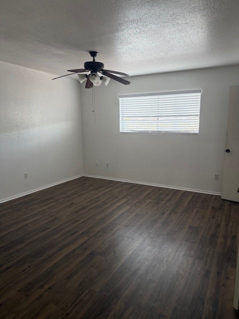8323 Wilcrest Drive, Unit 8004 Houston, TX 77072 - Photo 11 of 12 an empty room with wooden floor air conditioner and windows
