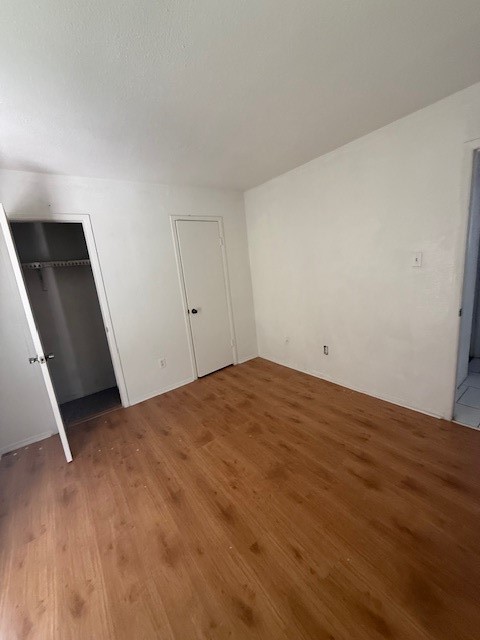 8323 Wilcrest Drive, Unit 8004 Houston, TX 77072 - Photo 5 of 12 a view of empty room with wooden floor