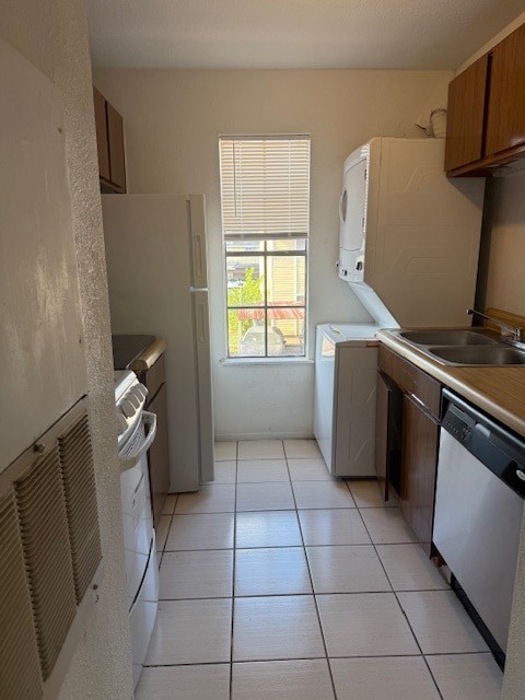 8323 Wilcrest Drive, Unit 8004 Houston, TX 77072 - Photo 8 of 12 a kitchen with a stove top oven and cabinets