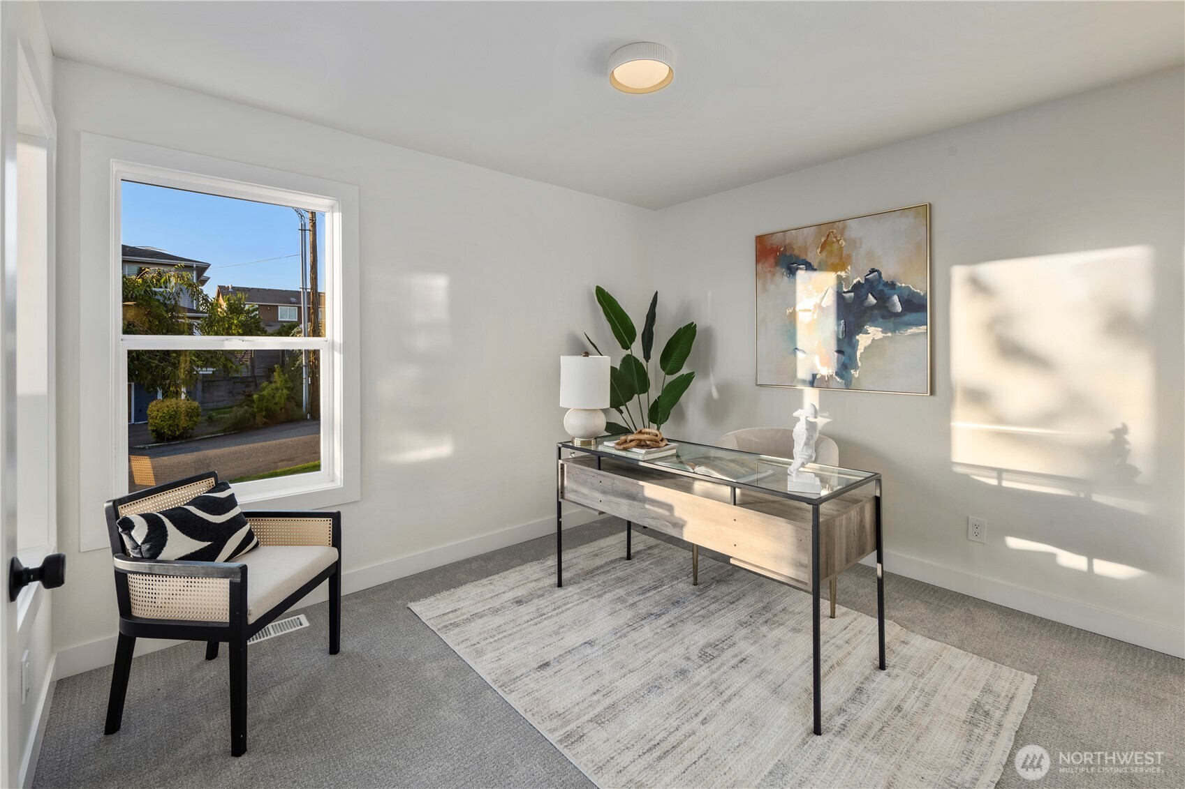 1005 North 33rd Street Renton, WA 98056 - Photo 13 of 36 a living room with furniture a rug and a window