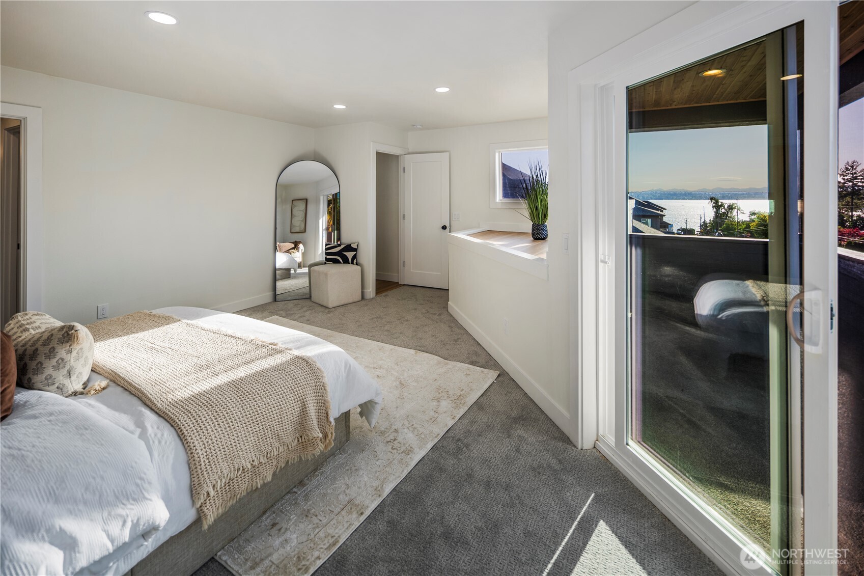 1005 North 33rd Street Renton, WA 98056 - Photo 16 of 36 a bedroom with a bed and a mirror