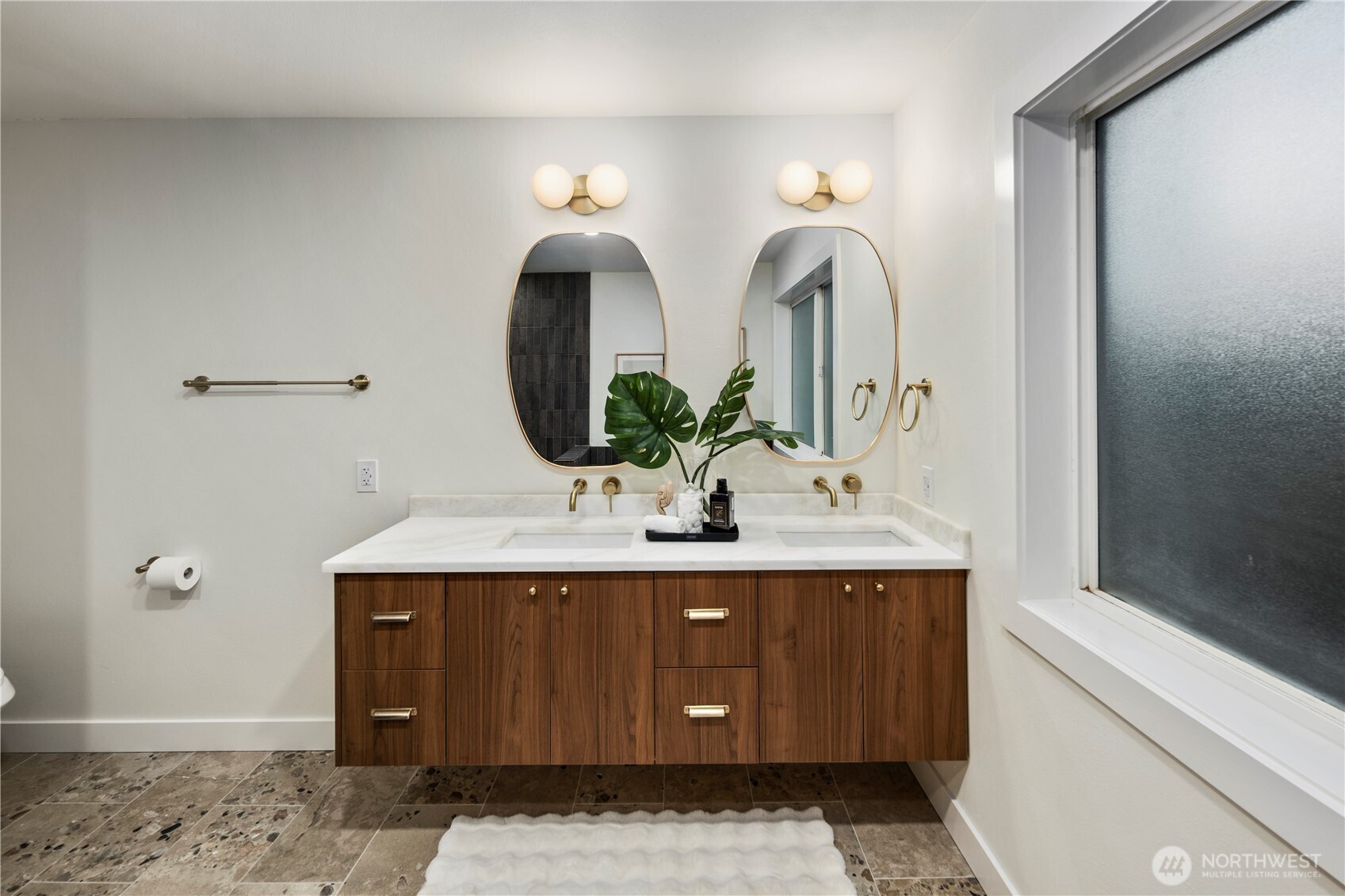 1005 North 33rd Street Renton, WA 98056 - Photo 17 of 36 a bathroom with a double vanity sink and a mirror