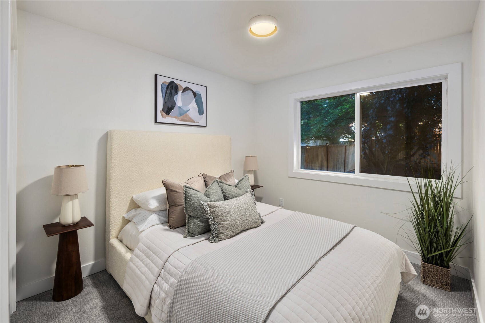 1005 North 33rd Street Renton, WA 98056 - Photo 21 of 36 a bedroom with a large bed and a window