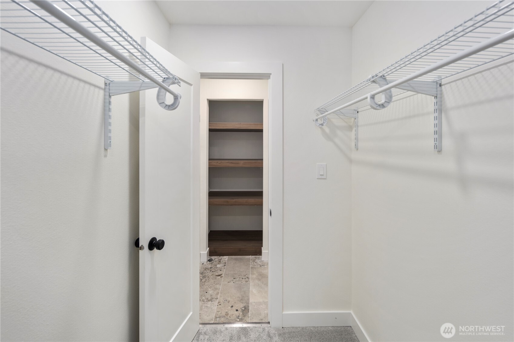 1005 North 33rd Street Renton, WA 98056 - Photo 26 of 36 a view of walk in closet with empty racks