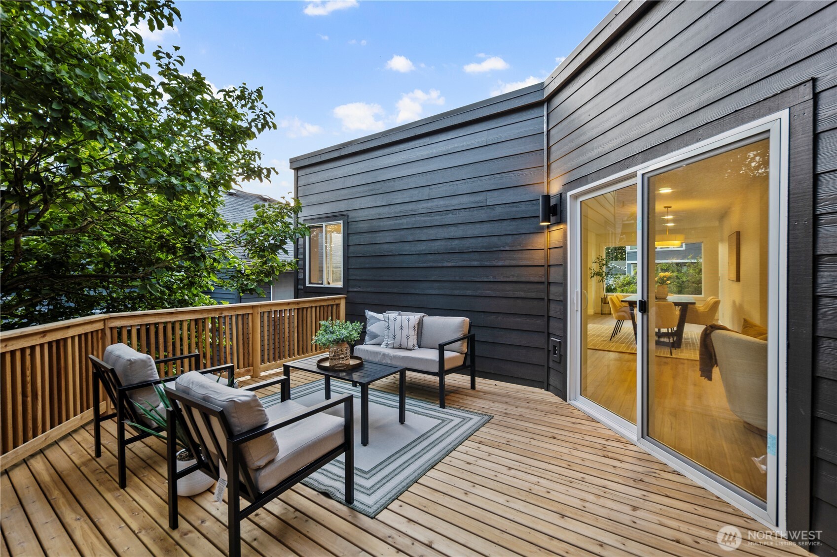 1005 North 33rd Street Renton, WA 98056 - Photo 27 of 36 a roof deck with a table and chairs