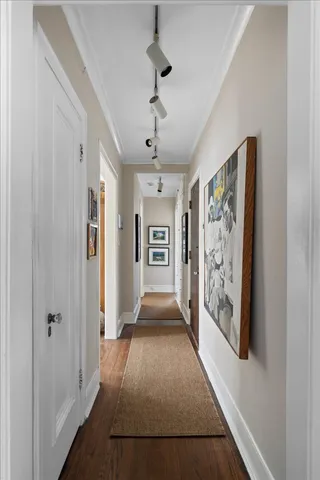 a view of entryway with window and wooden floor