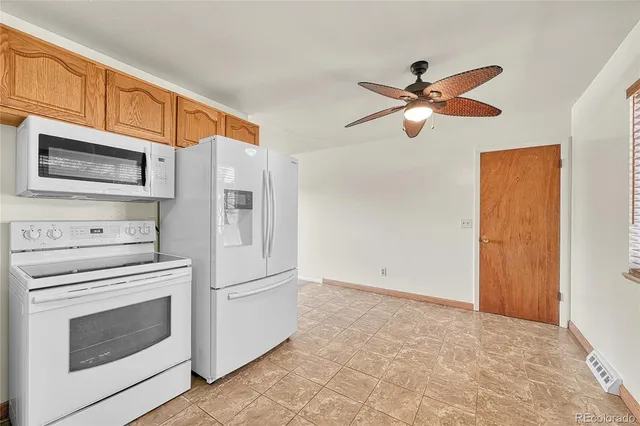 a kitchen with stainless steel appliances a stove microwave and a refrigerator