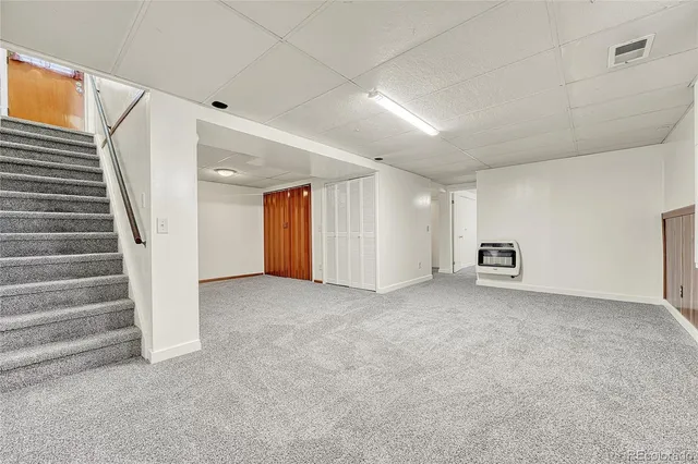 a view of an empty room with stairs