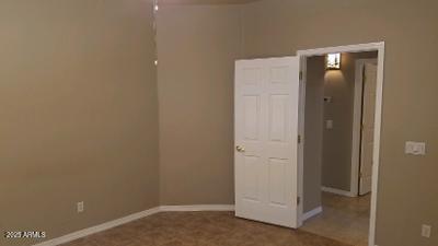 303 West Christopher Point Payson, AZ 85541 - Photo 15 of 27 an empty room with closet and wooden door