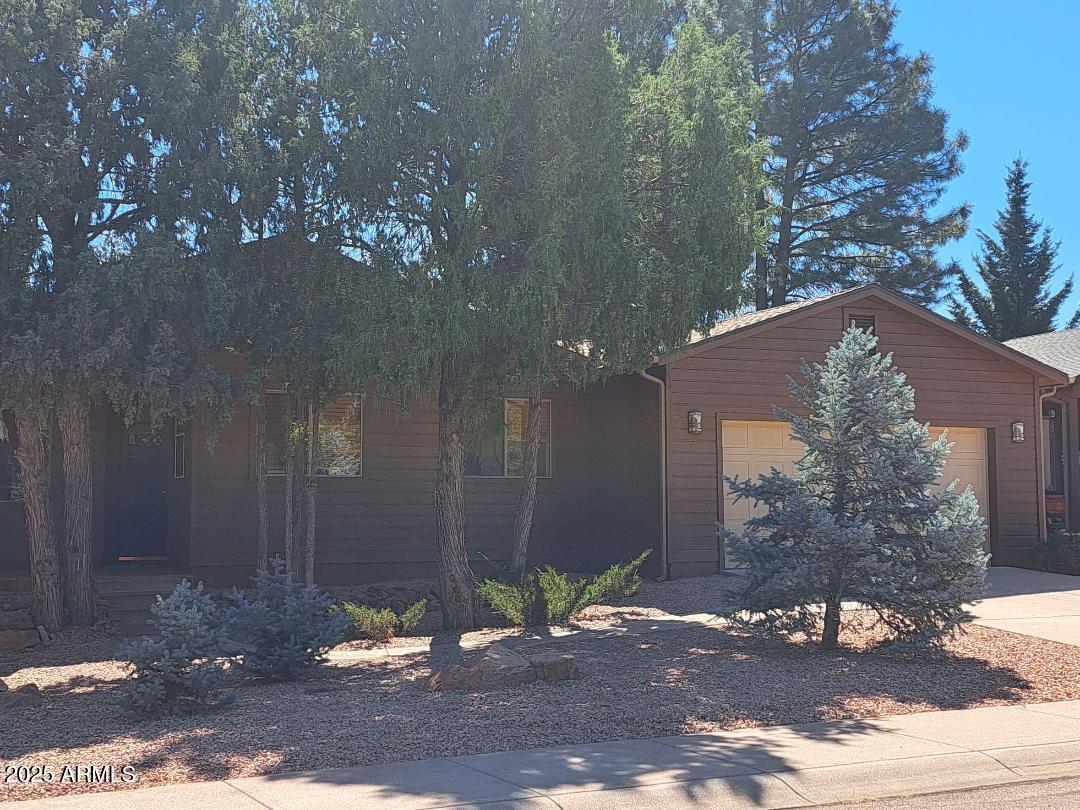 303 West Christopher Point Payson, AZ 85541 - Photo 2 of 27 a wooden bench sitting in front of a building