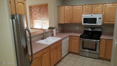 303 West Christopher Point Payson, AZ 85541 - Photo 10 of 27 a kitchen with stainless steel appliances granite countertop a sink stove and microwave