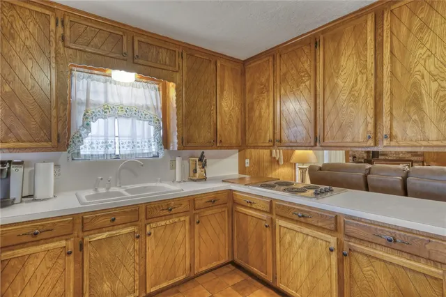 a front view of a house with swimming pool having outdoor seating