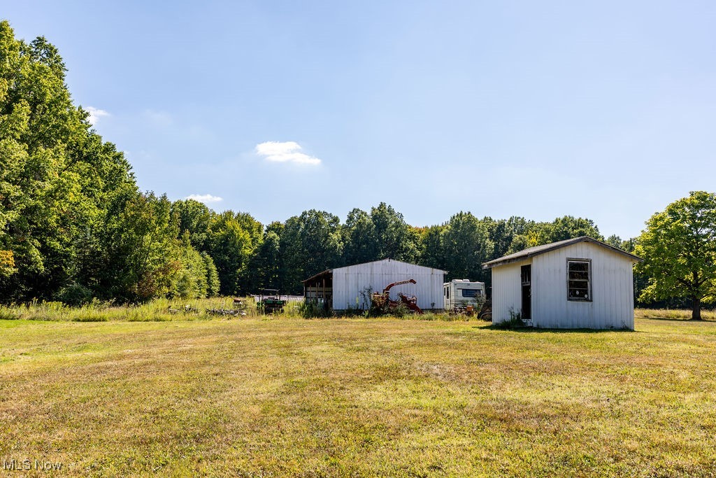 8131 Leffingwell Road Canfield, OH 44406 - Photo 4 of 37 View of green lawn with an outbuilding