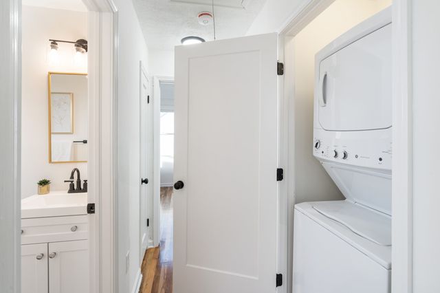 a bathroom with a shower a toilet and a sink