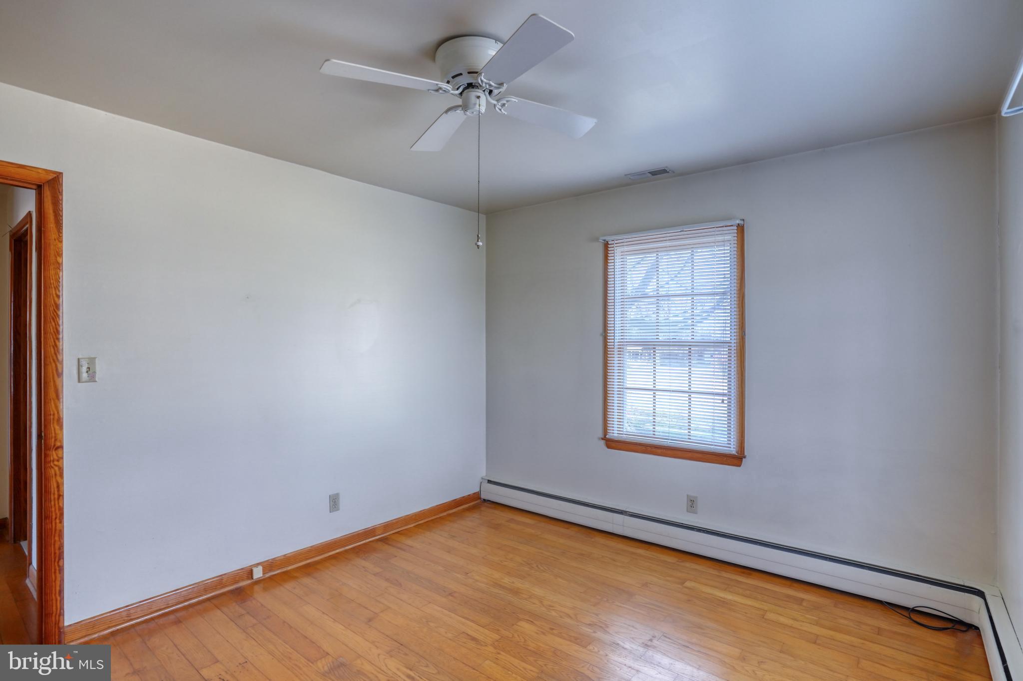 4215 Preston Road Hurlock, MD 21643 - Photo 20 of 40 an empty room with windows and fan