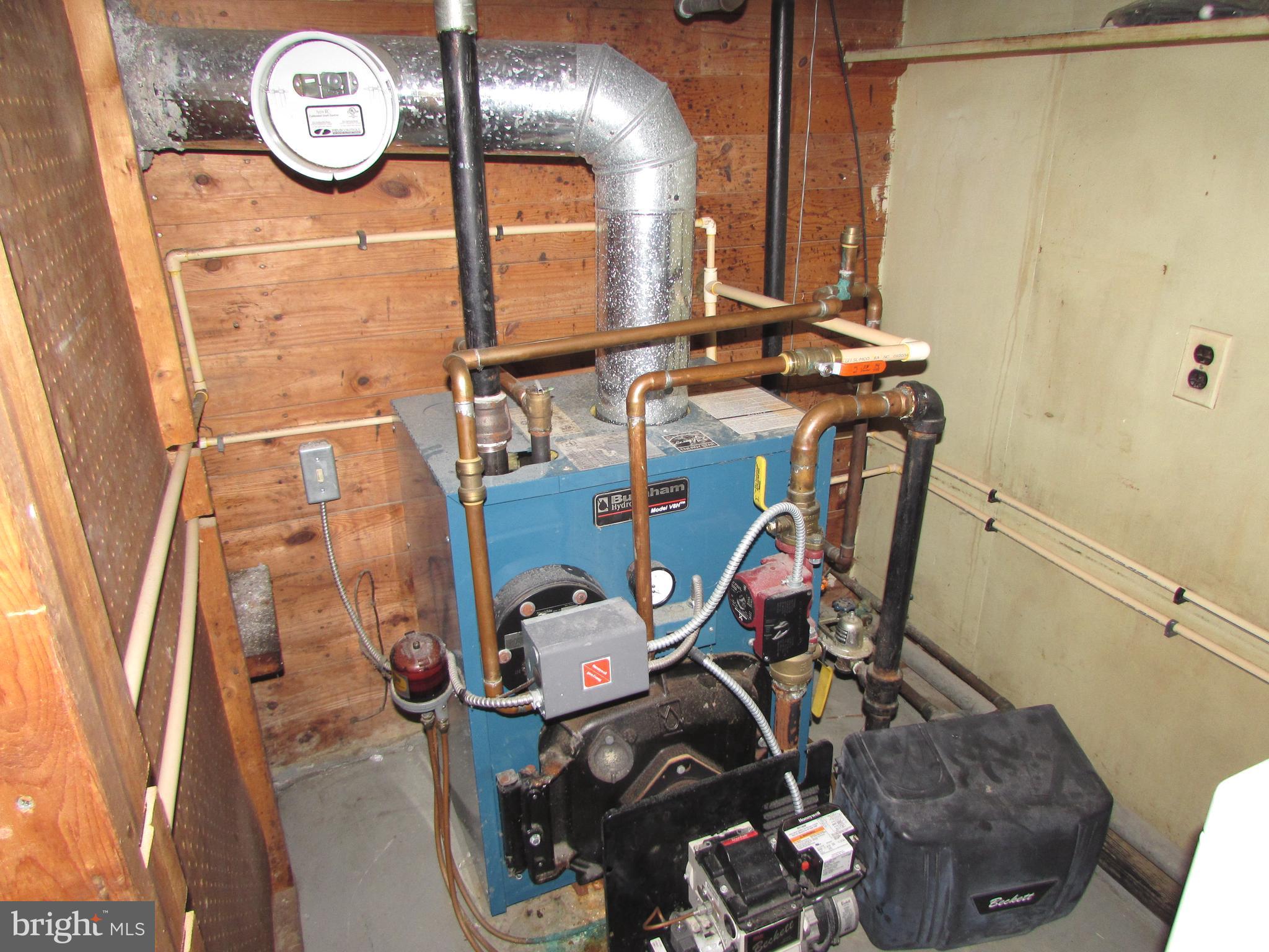 4215 Preston Road Hurlock, MD 21643 - Photo 29 of 40 a view of storage and utility room with racks on the wall